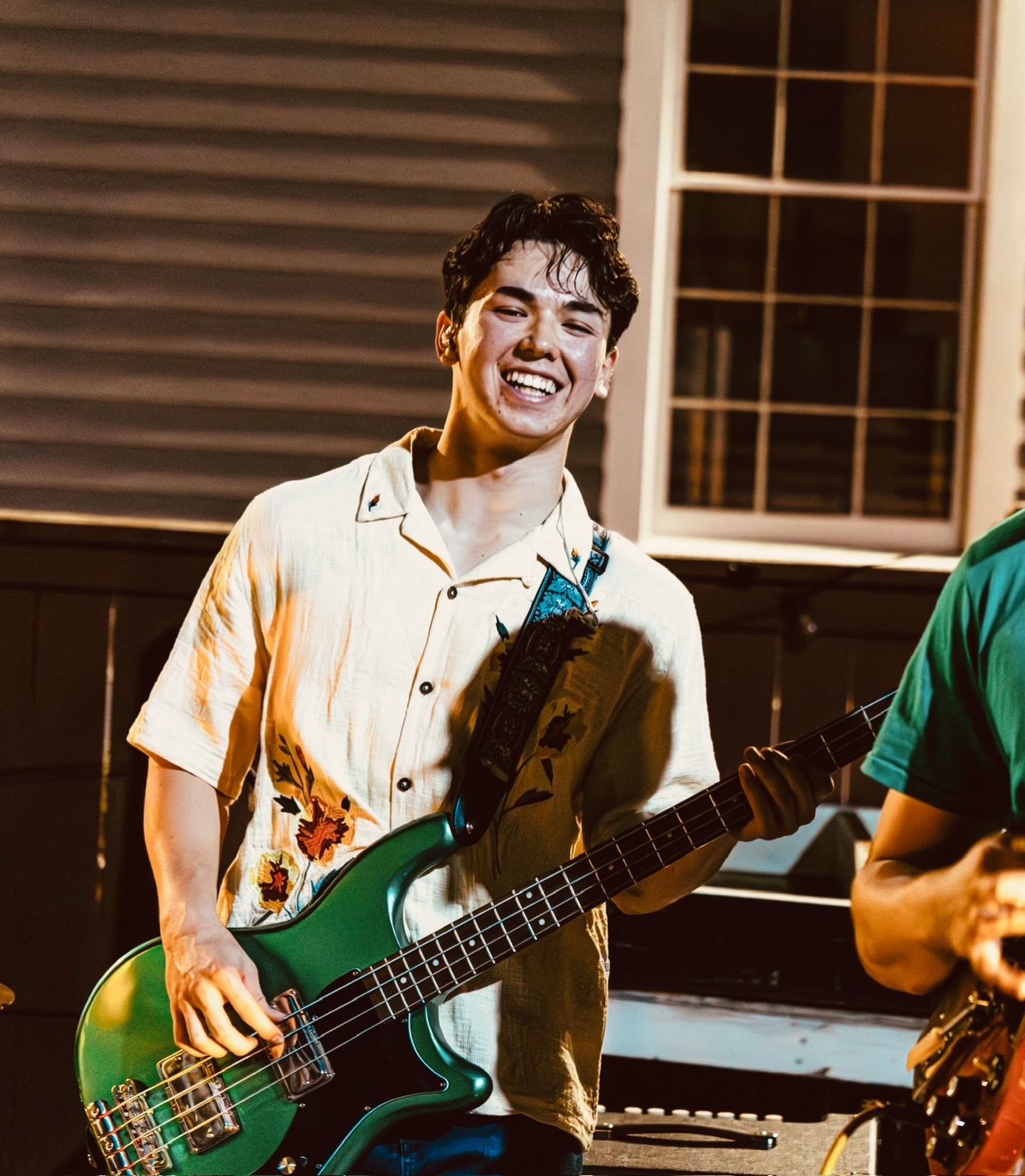 Cooper laughing with green Embassy bass